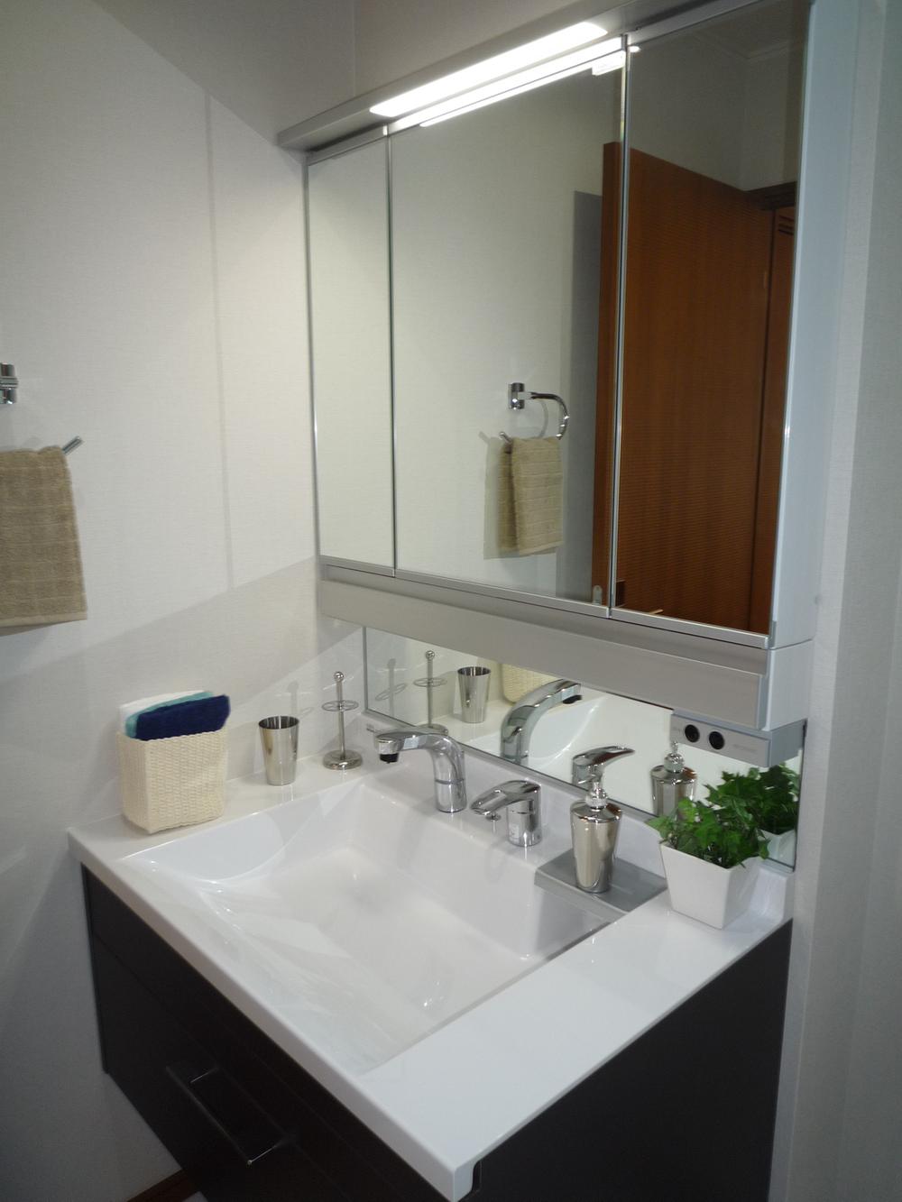 Wash basin, toilet. Vanity is vanity shower.