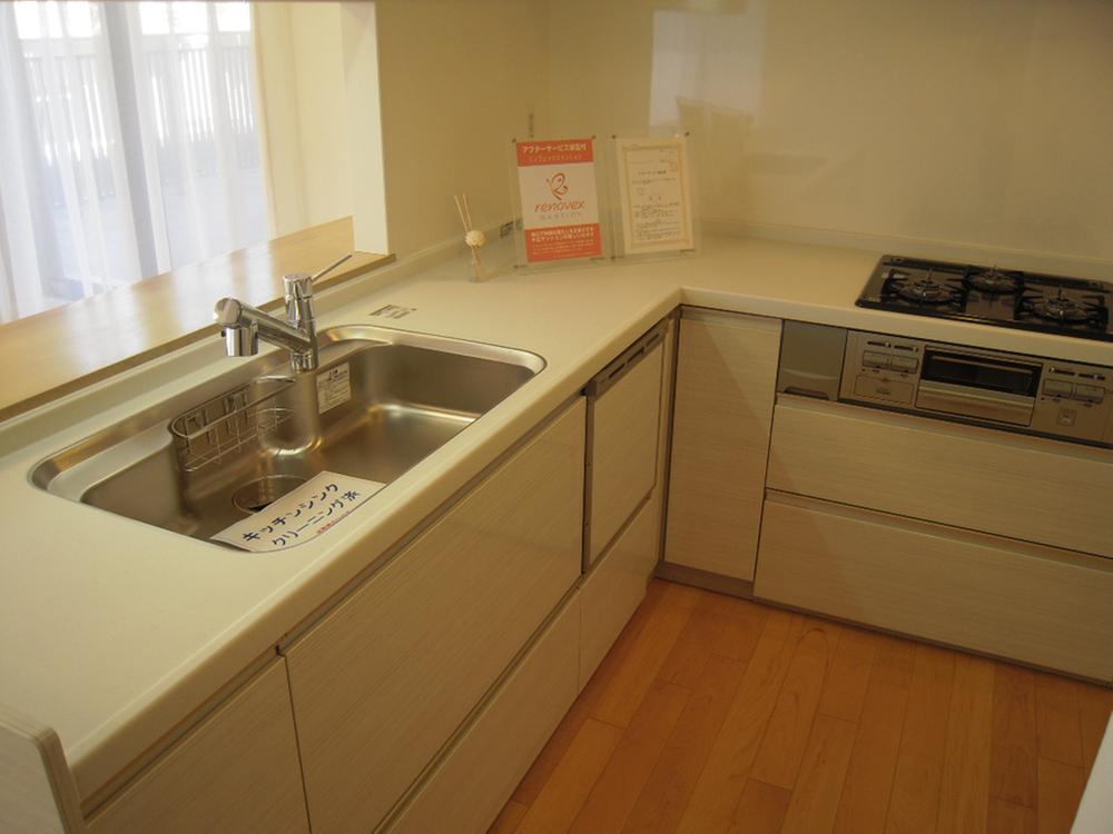 Living. It is a good L-shaped counter kitchen usability.