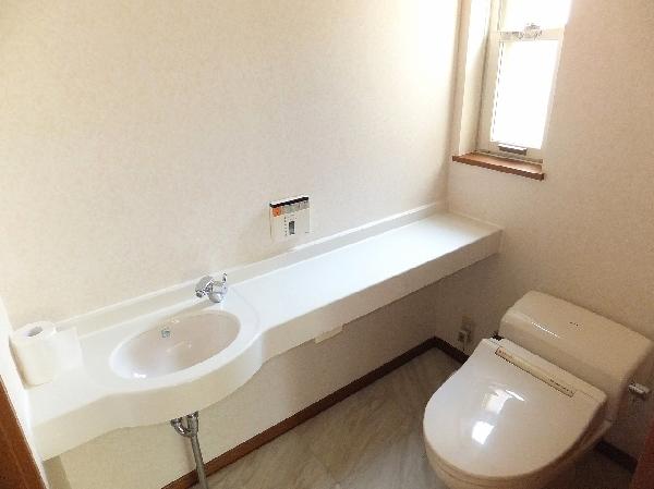 Toilet. There is a spacious space.