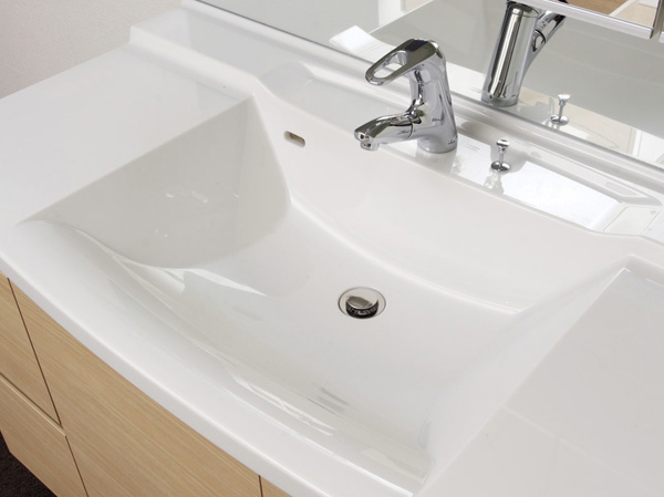 Bathing-wash room.  [Artificial marble bowl integrated counter] Basin counter bowl-integrated specification of artificial marble. Corner portion is also a gentle curved shape, It is easy to clean.