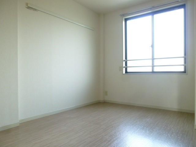 Other room space. It is bright and there is a window in the bedroom