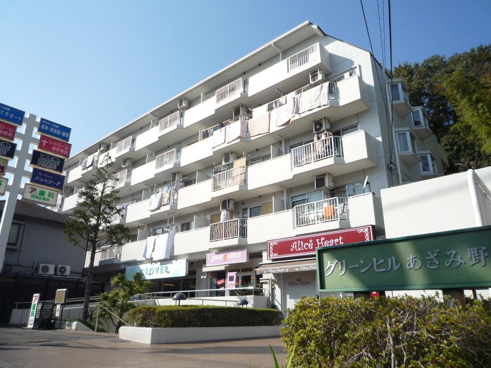 Local appearance photo. The top floor is the right-hand side of the corner room.