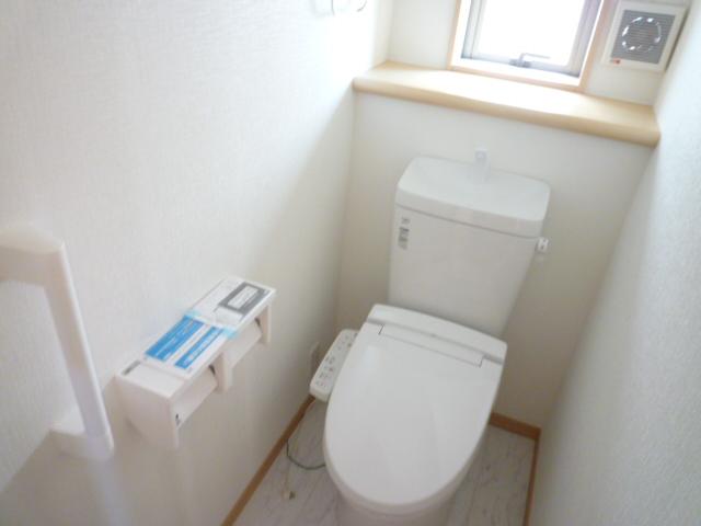 Toilet. Is a toilet handrail is with
