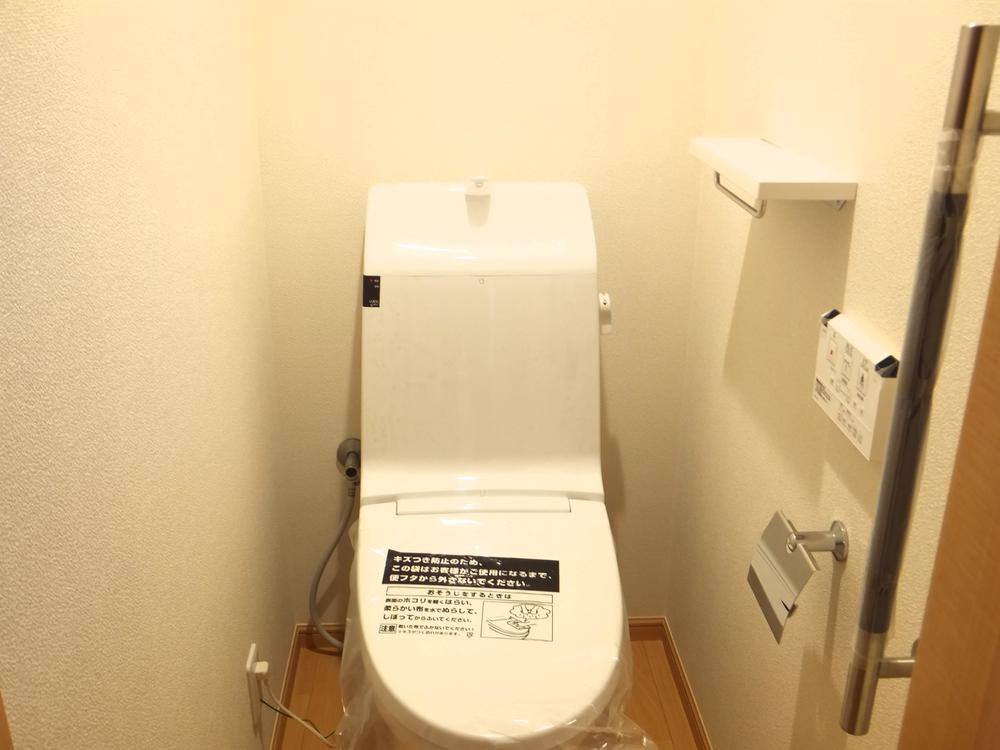 Toilet. Toilet is equipped with Washlet