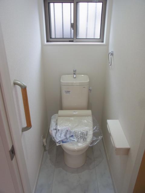 Toilet. Peace of mind with comfortable handrail in with Washlet