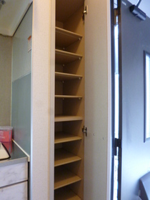 Entrance. Convenient shoebox storage of shoes