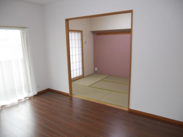 Living. Next to the living room is a Japanese-style room
