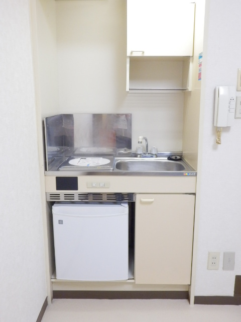 Kitchen. A kitchen with a mini fridge. IH stove new!