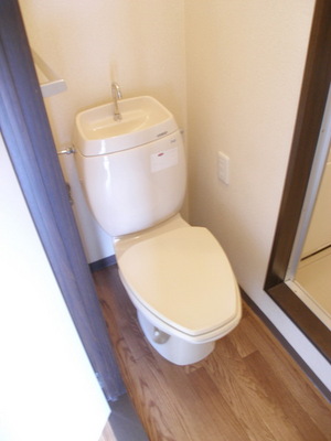 Toilet. It will be photos of the same type of room.