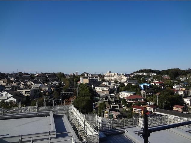 View photos from the dwelling unit. Please look at the view from the top floor from local
