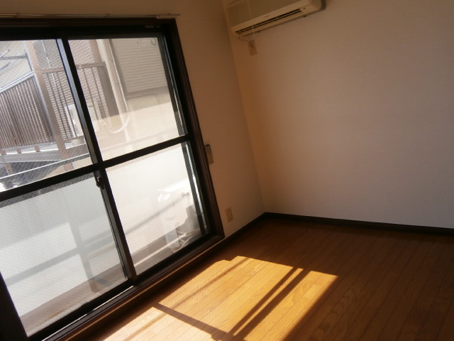Other room space. The back of the room is also sunny.