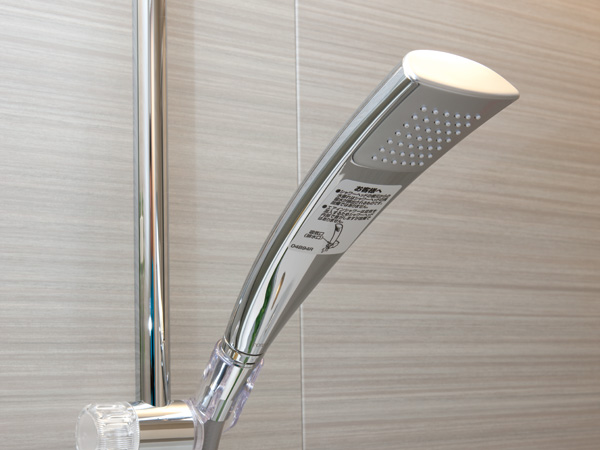 Bathing-wash room.  [shower head] Shower with slide bar that can be adjusted freely height.
