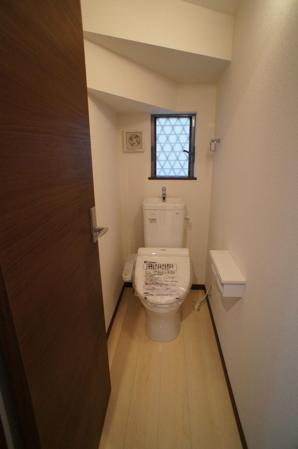 Toilet. The first floor of the restroom has been installed in the space under the stairs. It has adopted the warm water washing toilet seat.