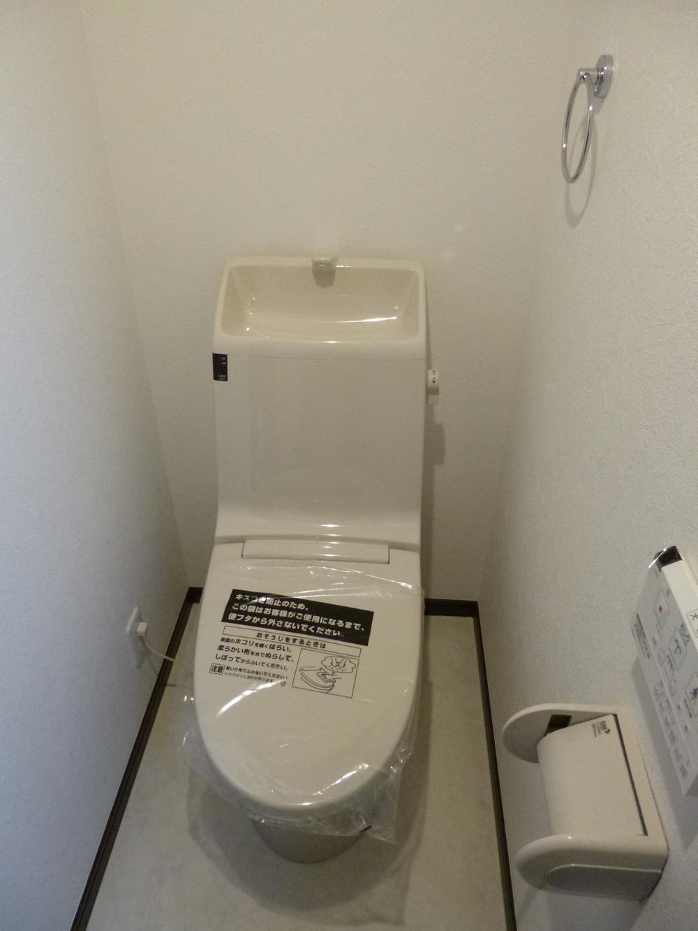 Toilet. B Building Comfortable with Washlet