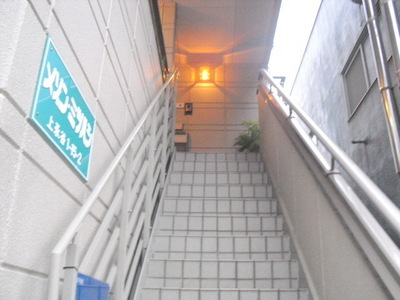 Entrance. Stairs to the second floor building