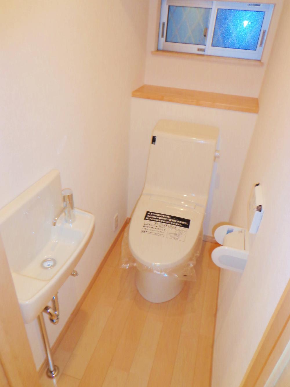 Toilet. First floor rest room and spacious with a hand-wash