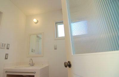 Wash basin, toilet. Design glass of white door