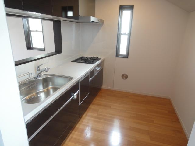 Kitchen. It is face-to-face system kitchen conversation of family bouncy. There is also a veranda, which is out of the kitchen. (5 Building)