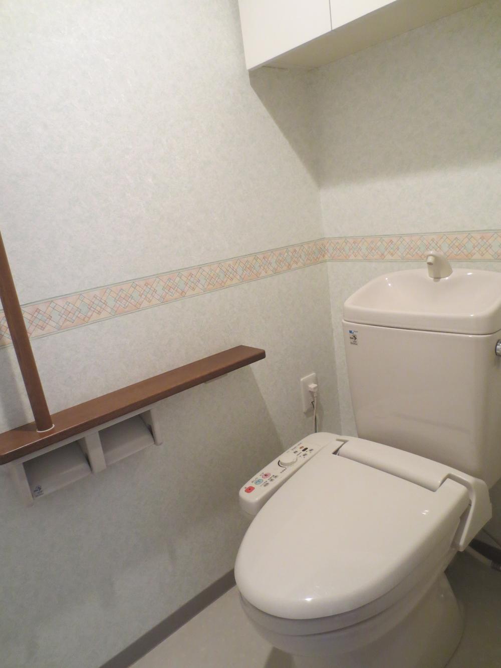 Toilet. Toilet is equipped with a hanging cupboard, Convenient for daily necessities of stock.