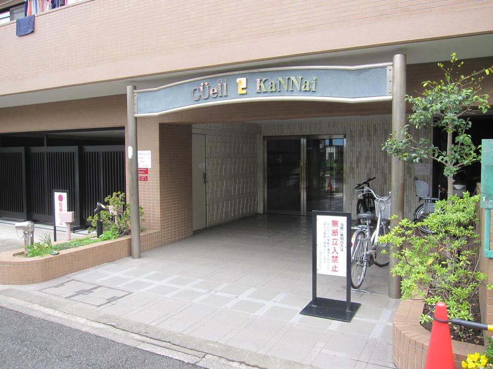 Entrance. Entrance appearance. Outer wall is tiled inconspicuous dirt.