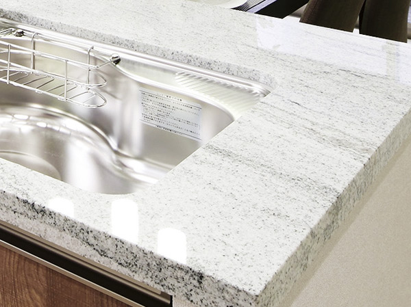 Kitchen.  [Natural stone counter tops] Use the natural stone with a beautiful dignity kitchen counter tops. It is a flat type with a profound feeling.