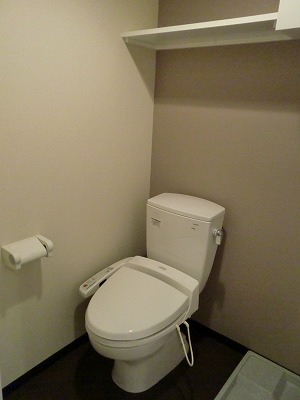 Toilet. Bidet with a picture of the other rooms.