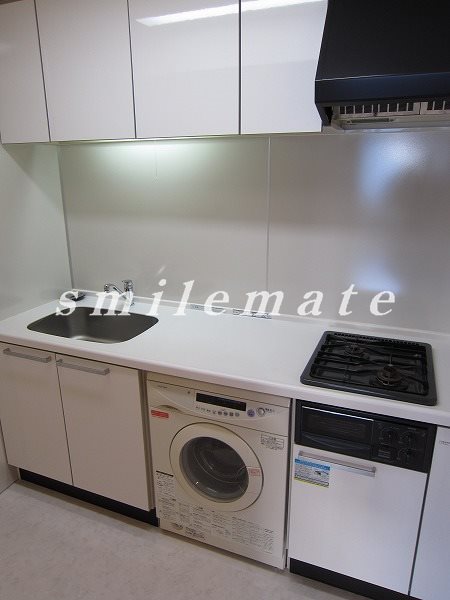 Kitchen. It is with a drum-type washing machine