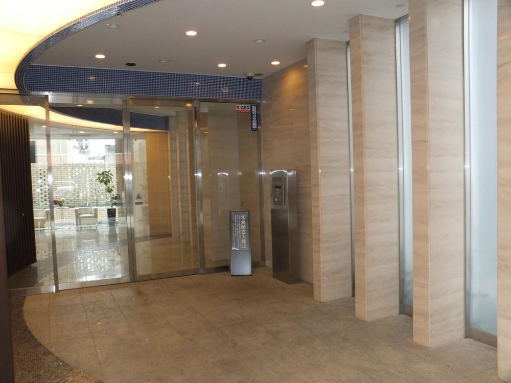 Entrance. Entrance is auto-lock system with a TV monitor. Because the face of the visitors can see on the monitor, Peace of mind.