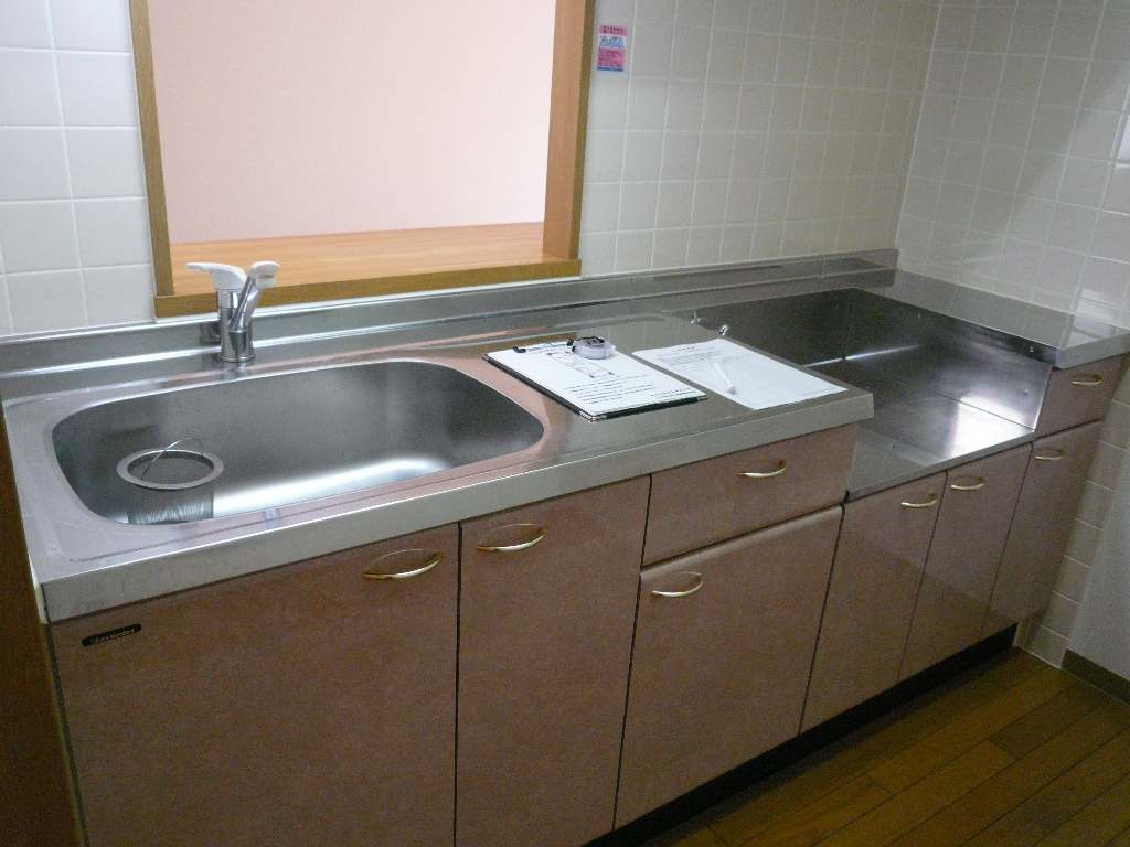 Kitchen. The photograph is another dwelling unit of the same type.