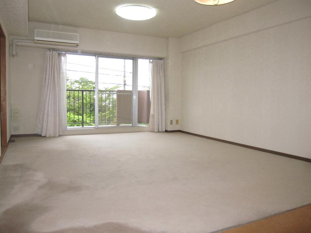 Living. You can enter and exit to the east balcony from the living room.