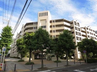 Building appearance. White tiles shine in blue sky