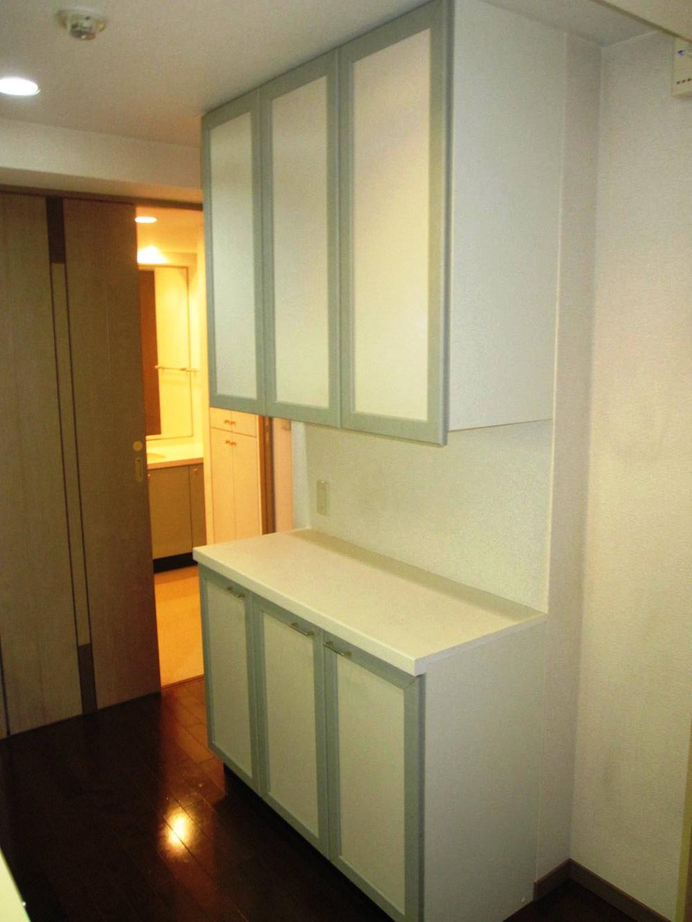 Kitchen. The kitchen back, It comes with a storage rack of similar colors.