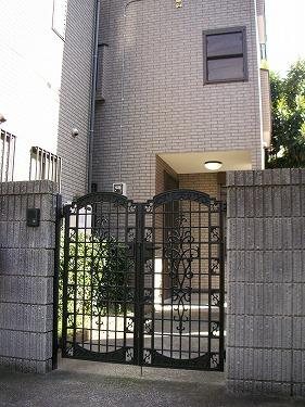 Entrance. There is a gate to the front door. There is space to plant, such as flowers in the approach part of to the door. 