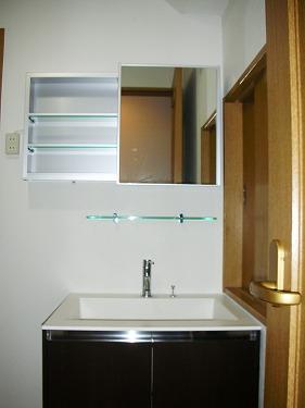 Wash basin, toilet. There is housed in a wash basin next to. There is also a window to the wash room.