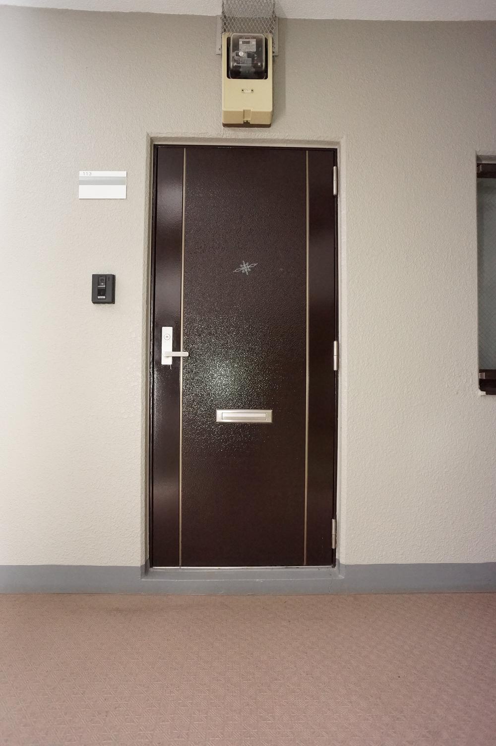 Other common areas. It is the entrance door as seen from the shared portion passage! There is also the back door!