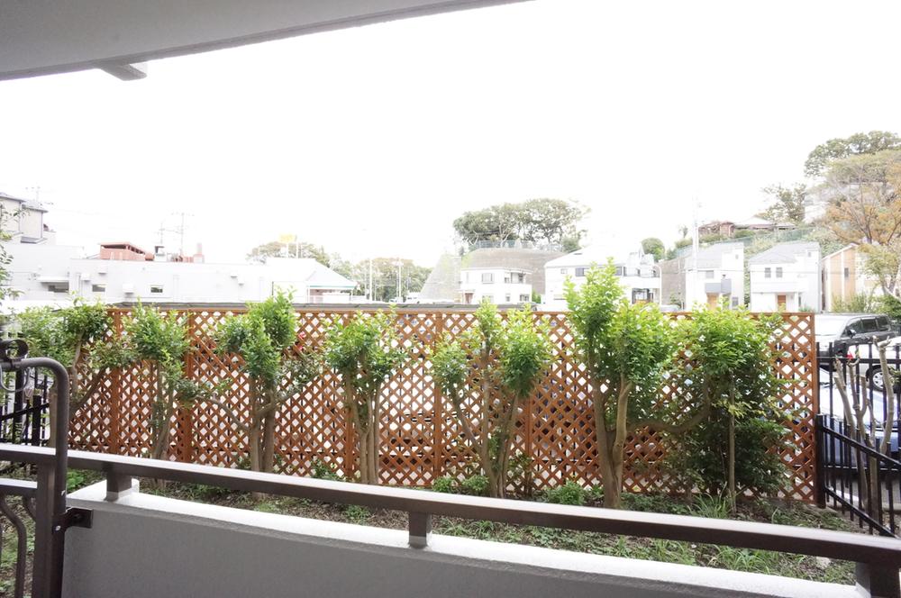 View photos from the dwelling unit. Beyond the private garden is the parking lot!