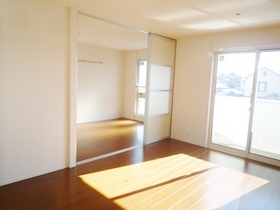 Living and room. In open space if you open the sliding door