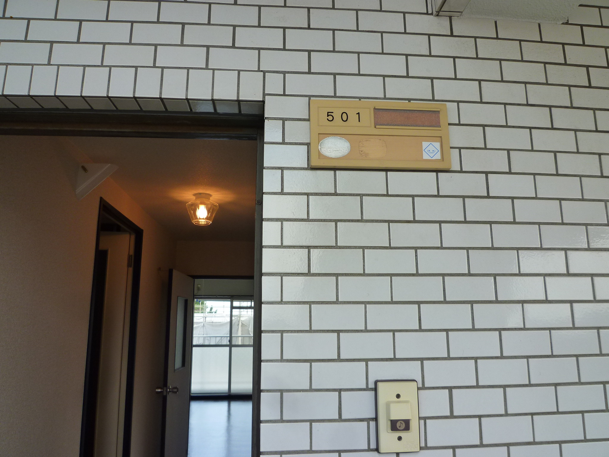 Entrance. Entrance door portion of the tiled