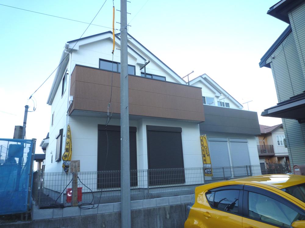 Local appearance photo. Sunny attached to the south side adjacent land road