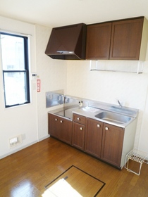 Kitchen. Small window & floor with storage