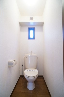 Toilet. It has a small window