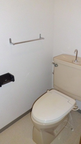 Toilet. Toilet is with storage and electrical outlet