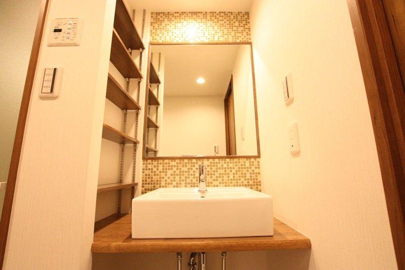 Wash basin, toilet. Wash basin was finished with mosaic tile specification