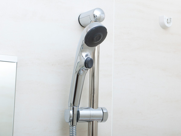Bathing-wash room.  [Water-saving shower head] You can open and close the faucet at hand operation, Water-saving shower head.