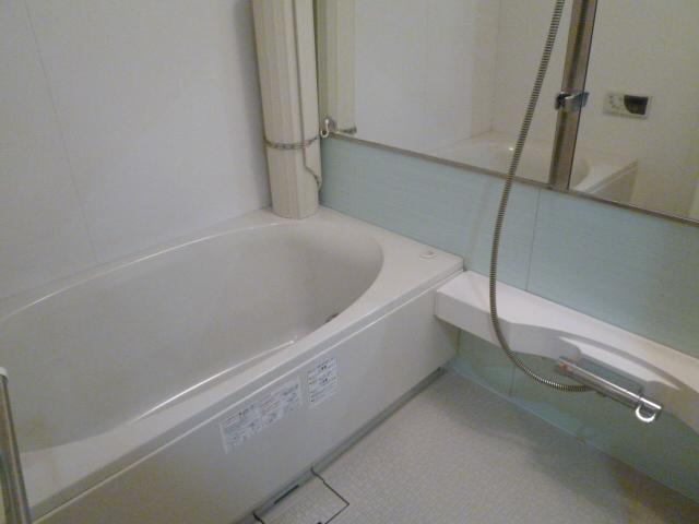 Bathroom. It is highly functional bath with large mirror.