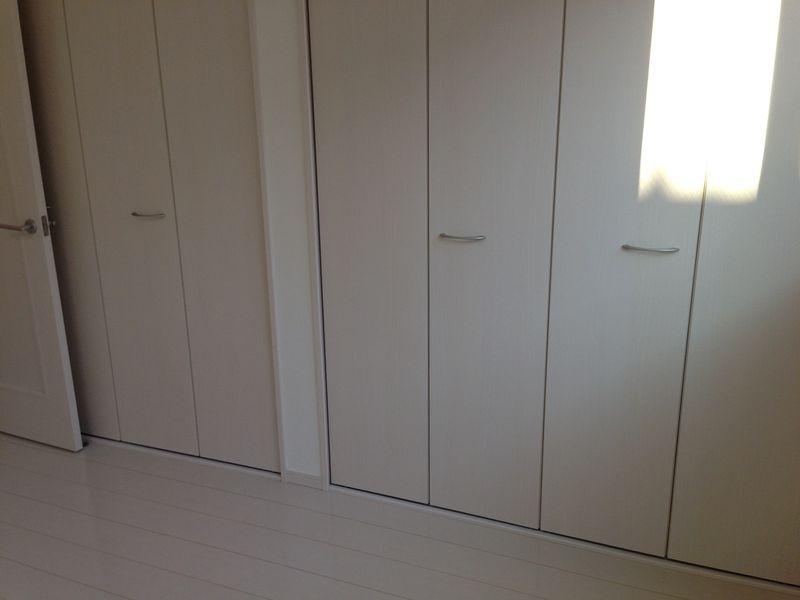 Non-living room. White storage door