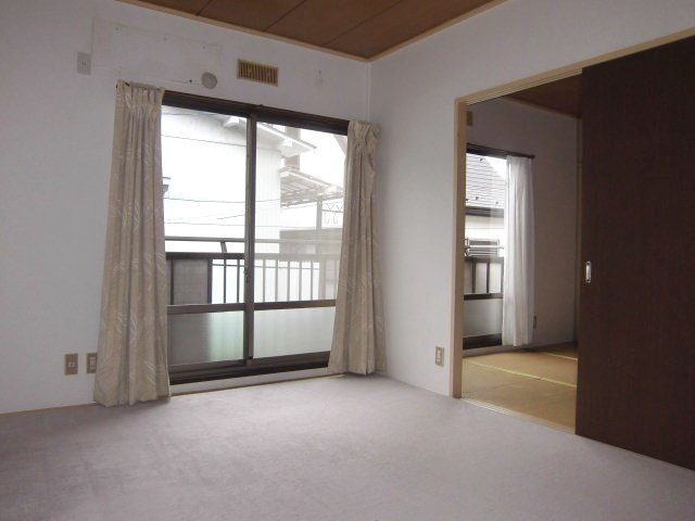 Living and room. It has become carpeted on top of the Japanese-style room