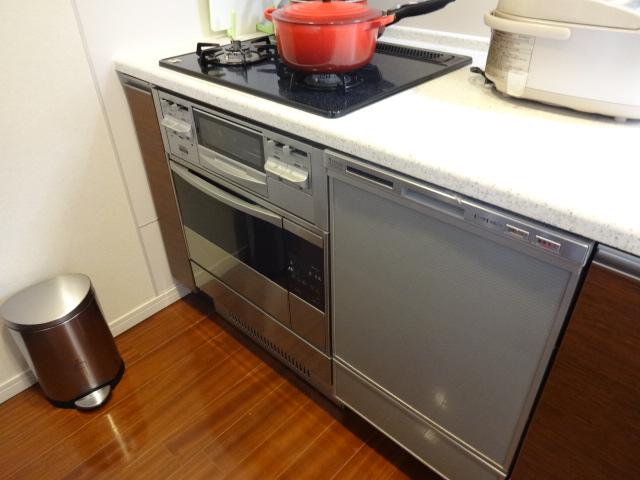 Kitchen. There is a built-in dishwasher and oven.