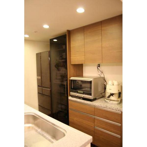 Kitchen. Cleanup made of kitchen storage. Top plate natural marble