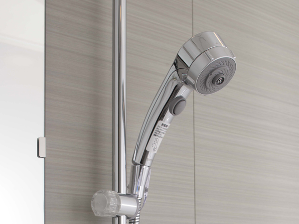 Bathing-wash room.  [Water-saving shower faucet] It has adopted a water-saving shower faucet that can control the water flow at the push of a button attached to the shower head.